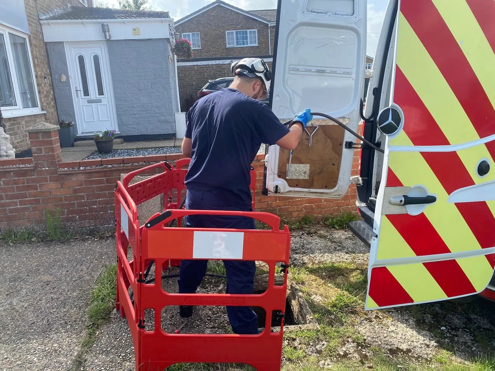 Phil Mordecai jetting a drain from the van