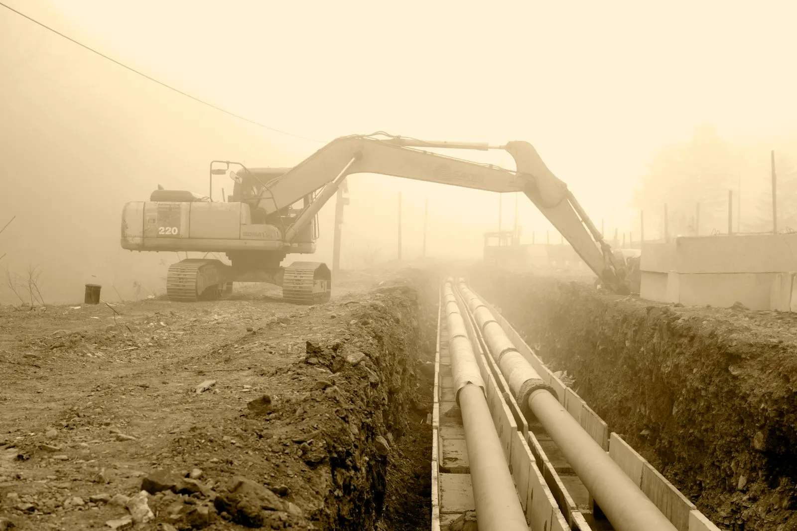 Drainage pipes exposed in an excavated trench